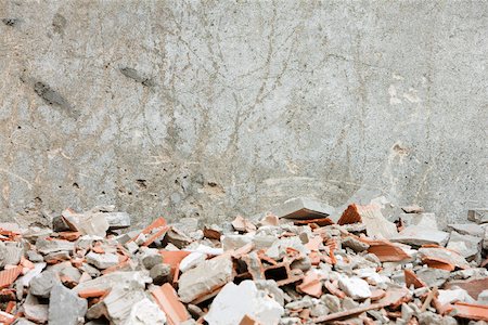 Construction rubble, broken bricks, pieces of concrete against wall Stock Photo - Premium Royalty-Free, Code: 632-02885379