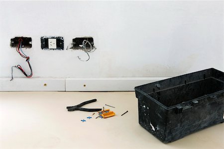electrical cord - Plastic toolbox, pliers on floor near unfinished electrical sockets Stock Photo - Premium Royalty-Free, Code: 632-02885380