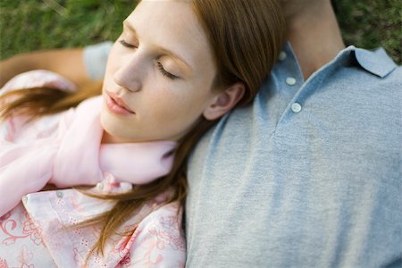 Young couple napping on ground, woman's head resting on man's chest Stock Photo - Premium Royalty-Free, Code: 632-02885446