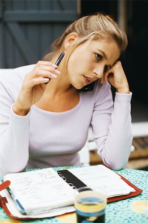 simsearch:614-06312057,k - Woman with open agenda, contemplatively looking away Stock Photo - Premium Royalty-Free, Code: 632-03027023