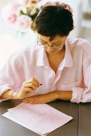 reading glasses top view - Woman writing and reviewing correspondence Stock Photo - Premium Royalty-Free, Code: 632-03027034