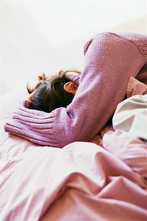 female broken heart - Woman lying on bed covering face with arm Stock Photo - Premium Royalty-Free, Code: 632-03027063