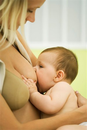 Woman breast feeding baby Stock Photo - Premium Royalty-Free, Code: 632-03027227
