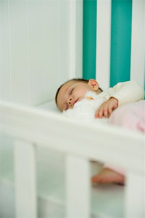 Baby sleeping in crib Foto de stock - Sin royalties Premium, Código: 632-03027256