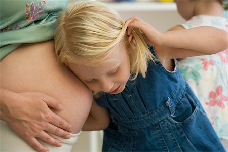 pregnant listen - Little girl listening to mother's pregnant belly Stock Photo - Premium Royalty-Free, Code: 632-03027285