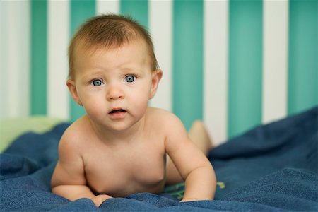Baby furrowing brow, looking at camera, portrait Stock Photo - Premium Royalty-Free, Code: 632-03027290