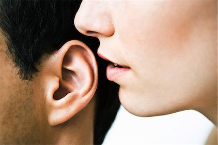 Woman whispering in man's ear, close-up Foto de stock - Sin royalties Premium, Código: 632-03083165