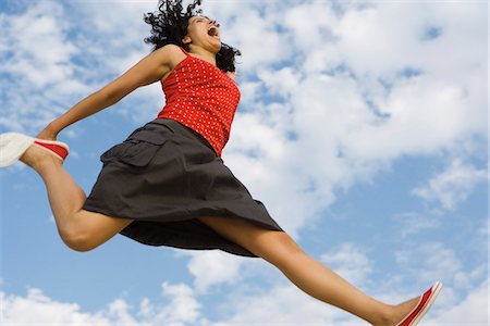 simsearch:633-01837186,k - Young woman jumping in midair, low angle view Stock Photo - Premium Royalty-Free, Code: 632-03083430