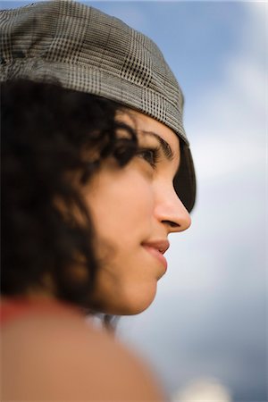 simsearch:632-01828538,k - Young woman looking away dreamily, profile Stock Photo - Premium Royalty-Free, Code: 632-03083459