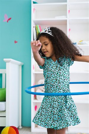 Little girl playing with plastic hoop Stock Photo - Premium Royalty-Free, Code: 632-03083565