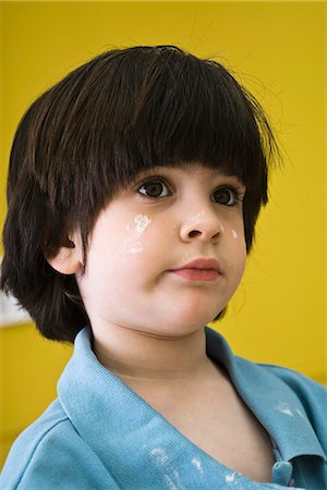 Little boy with flour on his face, portrait Stock Photo - Premium Royalty-Free, Code: 632-03083599