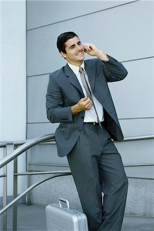 simsearch:632-03500931,k - Businessman using cell phone, leaning against railing Stock Photo - Premium Royalty-Free, Code: 632-03083720