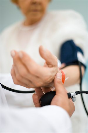 pressure - Doctor checking patient's blood pressure, cropped Stock Photo - Premium Royalty-Free, Code: 632-03193463