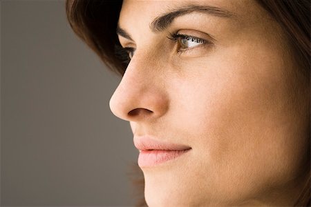 Young woman contemplatively looking away Stock Photo - Premium Royalty-Free, Code: 632-03403327