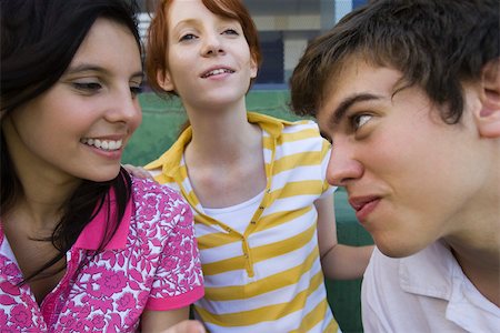 simsearch:632-01156768,k - Teenage boy playfully looking at girl friend with playful expression Stock Photo - Premium Royalty-Free, Code: 632-03424160