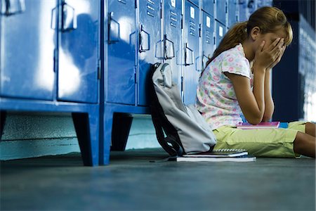 school sad images - Female junior high student sitting on hall floor near lockers, upset and covering face with hands Stock Photo - Premium Royalty-Free, Code: 632-03424192