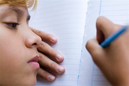 preteen girls faces close ups - Preteen girl writing in notebook Stock Photo - Premium Royalty-Free, Code: 632-03424541