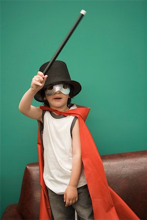 Boy in costume pretending to be magician Foto de stock - Sin royalties Premium, Código: 632-03424639
