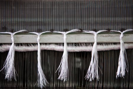 Loom in weaving mill, close-up of weaving reed Foto de stock - Sin royalties Premium, Código: 632-03500475