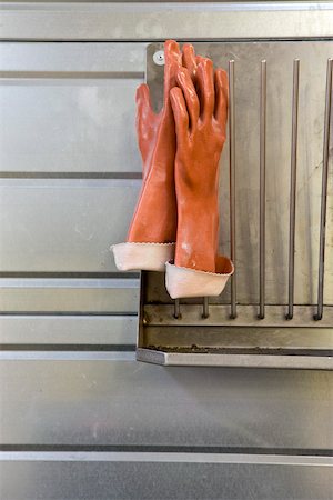 Fabric coating plant, rubber gloves drying on rack Stock Photo - Premium Royalty-Free, Code: 632-03500502