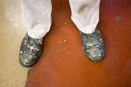 Fabric coating plant, machinist wearing safety boots Stock Photo - Premium Royalty-Free, Code: 632-03500503