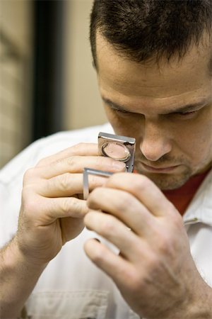 Recyclable composite textile fabrication department of factory, worker using a pick counter to inspect thread Stock Photo - Premium Royalty-Free, Code: 632-03500524