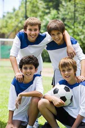 football kneeling - Young soccer teammates, portrait Stock Photo - Premium Royalty-Free, Code: 632-03500655