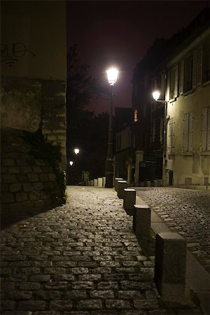 street lights in paris - Cobblestone street at night Stock Photo - Premium Royalty-Free, Code: 632-03500695