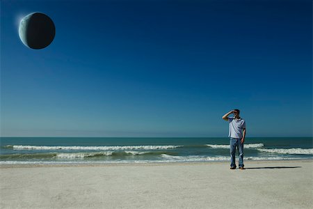 eclipse - Homme sur la plage observant eclipse Photographie de stock - Premium Libres de Droits, Code: 632-03500786