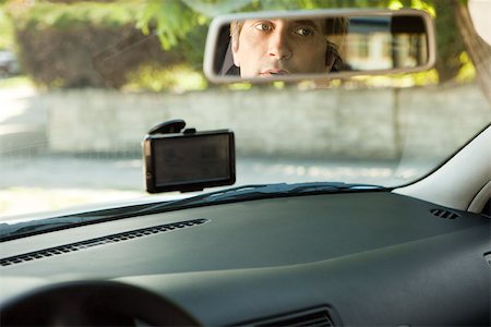 simsearch:632-03500895,k - Driver checking rear-view mirror Foto de stock - Sin royalties Premium, Código: 632-03500879