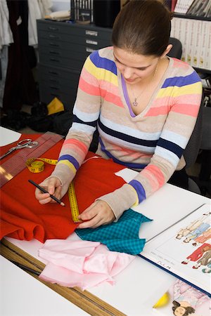 ruler woman - Preparing fabric for sewing project Stock Photo - Premium Royalty-Free, Code: 632-03501032