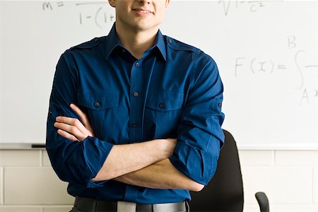 Teacher with arms folded, cropped Stock Photo - Premium Royalty-Free, Code: 632-03501054