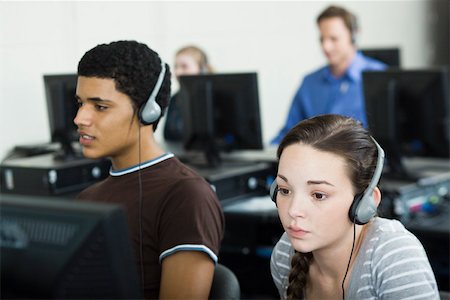 students teacher computers - Students learning in computer lab Stock Photo - Premium Royalty-Free, Code: 632-03516614