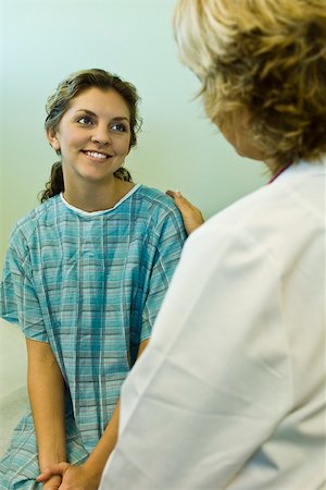 simsearch:632-03516799,k - Patient smiling with relief while receiving good news from doctor Stock Photo - Premium Royalty-Free, Code: 632-03516744