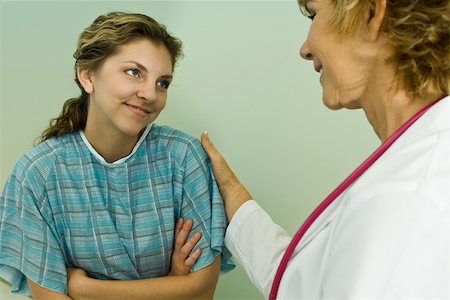 Patient smiling with relief while being reassured with good news Stock Photo - Premium Royalty-Free, Code: 632-03516747