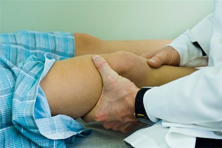 patient and worried and adults only - Doctor examining patient's leg and knee Stock Photo - Premium Royalty-Free, Code: 632-03516797