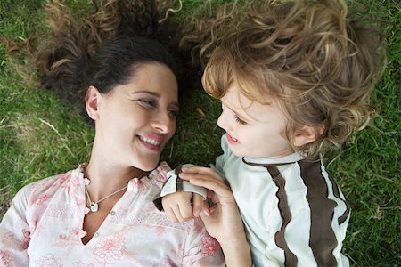 simsearch:632-05760167,k - Mother and young son lying on the ground together Stock Photo - Premium Royalty-Free, Code: 632-03516956