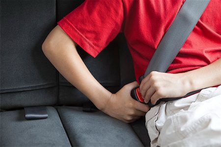 Child fastening car seat belt Stock Photo - Premium Royalty-Free, Code: 632-03516977