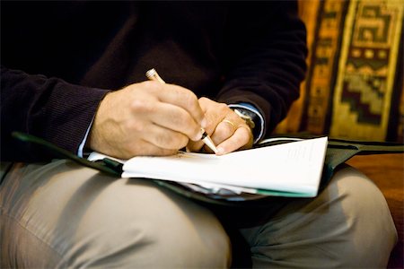 Man writing on note pad, cropped Stock Photo - Premium Royalty-Free, Code: 632-03629671