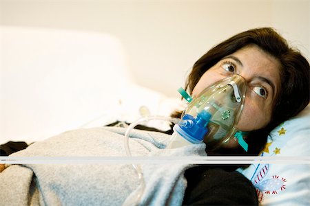 smoking issues - Woman receiving oxygen treatment Stock Photo - Premium Royalty-Free, Code: 632-03629680