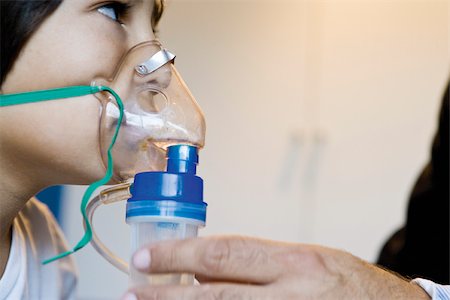 doctor treating kid - Boy receiving oxygen treatment Stock Photo - Premium Royalty-Free, Code: 632-03629706