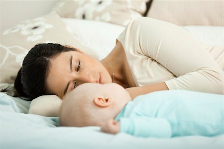 simsearch:632-03630113,k - Mother and baby resting together Fotografie stock - Premium Royalty-Free, Codice: 632-03630053