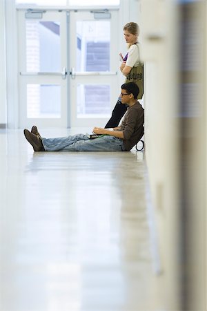 High school students hanging out in school corridor Stock Photo - Premium Royalty-Free, Code: 632-03630167