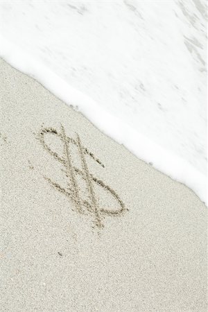 dollar sign - Dollar sign drawn in sand at the beach Foto de stock - Sin royalties Premium, Código: 632-03630237