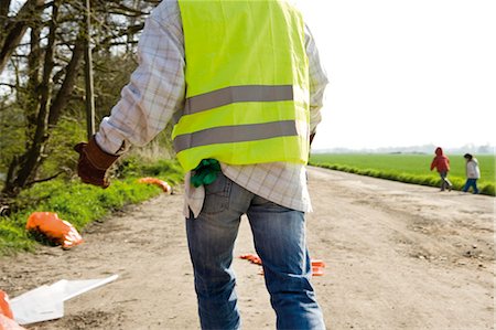 people cleaning rubbish - Picking up roadside litter Stock Photo - Premium Royalty-Free, Code: 632-03651661