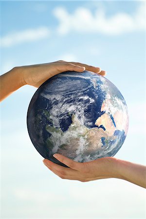 people on the globe - Two people's hands supporting one ball Stock Photo - Premium Royalty-Free, Code: 632-03651860