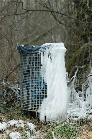 Ice collected on garbage can in park Stock Photo - Premium Royalty-Free, Code: 632-03651883