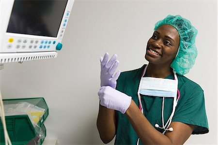 female doctor glove women only - Nurse checking medical equipment monitor Stock Photo - Premium Royalty-Free, Code: 632-03651978