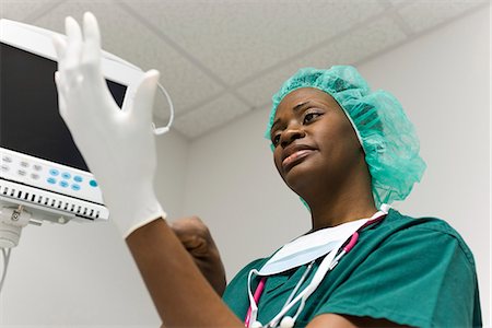 security monitors - Nurse putting on latex gloves Stock Photo - Premium Royalty-Free, Code: 632-03651982