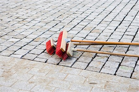 street cleaning - Brooms on cobblestone street Stock Photo - Premium Royalty-Free, Code: 632-03652233